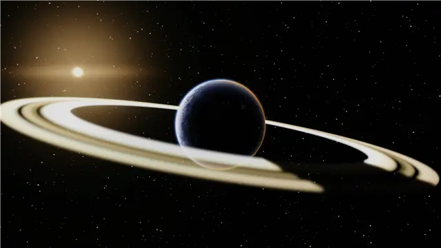 Ringed planet backlit by its parent star, with the planet's shadow visible across the rings